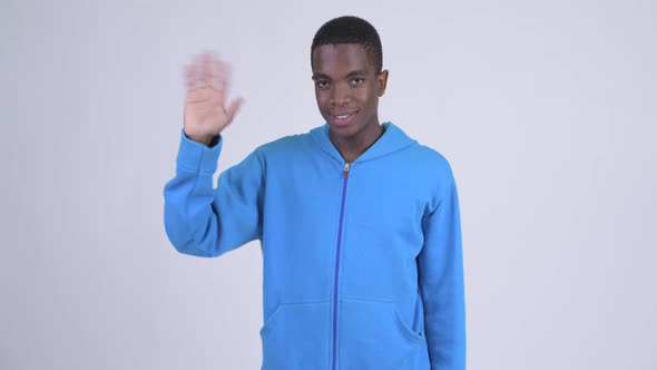 Young Happy African Man Waving Hand