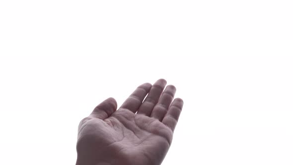 Person does hand gesture with bright white backdrop 12