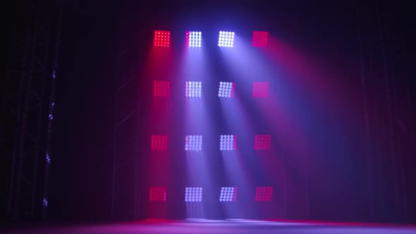 The Stage of a Small Theater with Red and Blue Spotlights. Lights Are Turned on From Darkness.