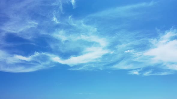 Wide above tourism shot of a sunshine white sandy paradise beach and aqua blue water background in v