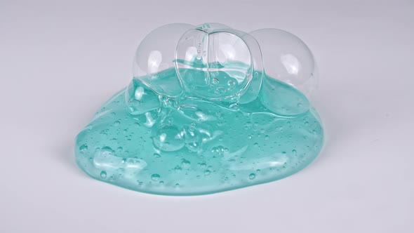 Pouring Transparent Blue Cosmetic Gel Cream With Molecule Bubbles alt