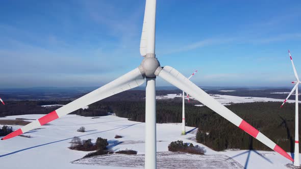 Closeup of a rotating wind turbine. Closeup of a wind turbine nacelle. Aerial view of a wind farm.