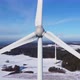 Closeup of a rotating wind turbine. Closeup of a wind turbine nacelle. Aerial view of a wind farm. - VideoHive Item for Sale