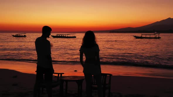 Boy and girl posing on paradise bay beach adventure by shallow lagoon and white sand background of G