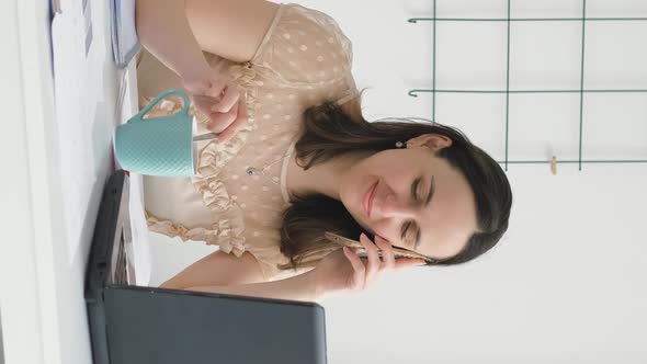 Businesswoman Talking on Her Phone in Office