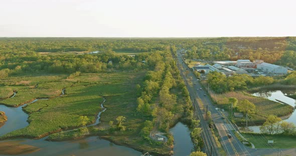 Aerial View Road Panorama Highway Near a Small Town in New Jersey Along Green Forest