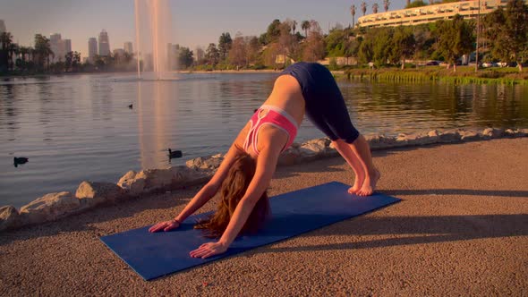 Woman Doing Yoga In The Park At Dawn