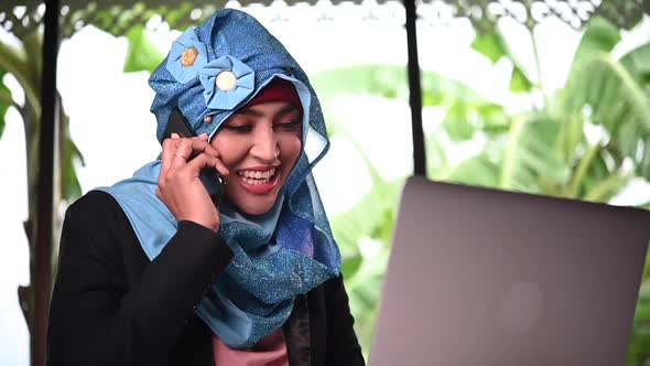 Young arabic woman talking with customer work at home