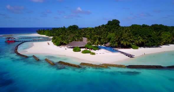 Natural flying travel shot of a summer white paradise sand beach and aqua turquoise water background