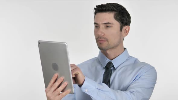 Businessman Excited for Success While Using Tablet