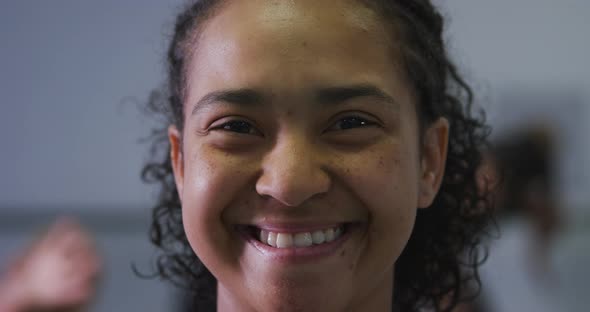 Portrait of a mixed race modern female dancer looking at the camera