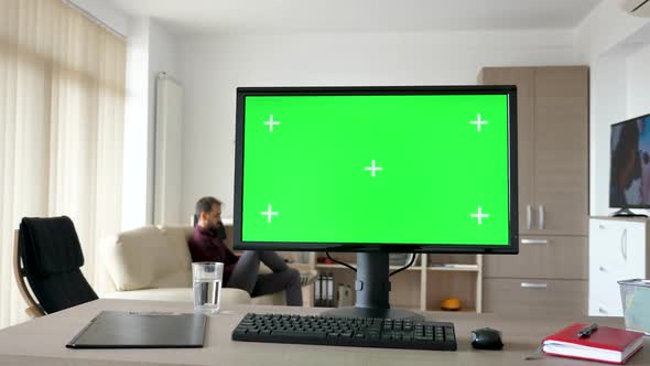 Personal PC with Big Green Screen Chroma Mock Up on the Table