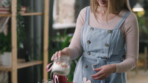 Woman Preparing Easter Gift Basket