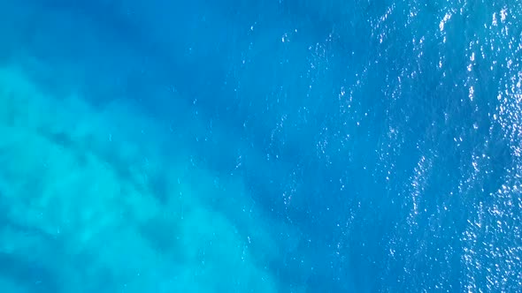 Aerial drone nature of bay beach break by water with sand background