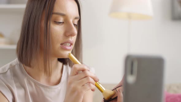 Woman Applying Contour Powder