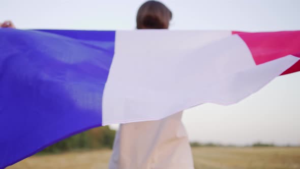 A French Woman Celebrates with the National Flag