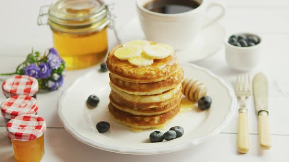 Pancakes with Slices of Banana and Berries