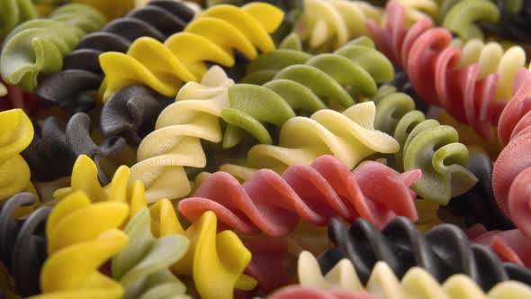 Multicolored colorful uncooked fusilli pasta