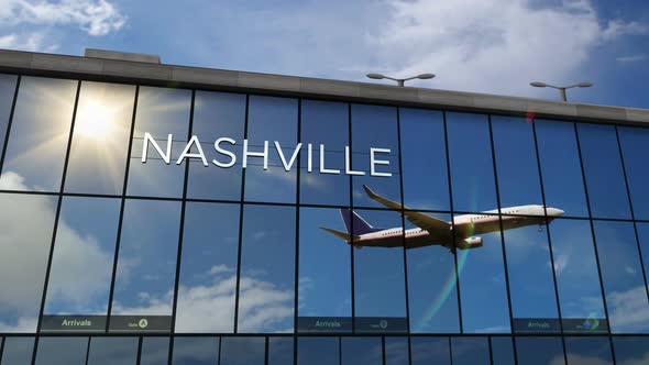 Airplane landing at Nashville Tennessee, USA airport mirrored in terminal
