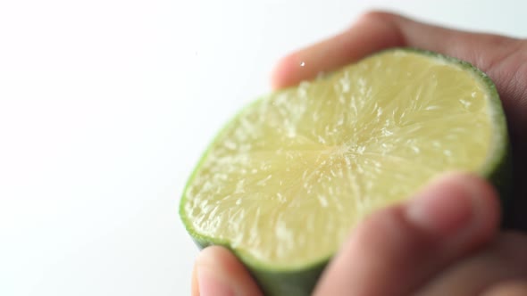 Squeezing lime. Slow Motion.