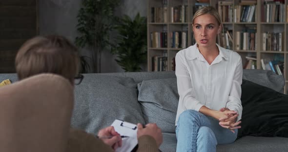 Excited Lady Explaining Gesticulating Consulting with Lawyer to Divorce Process Sitting Couch Parlor
