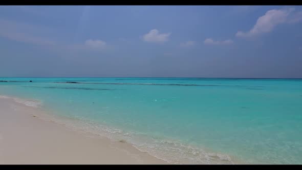 Aerial drone view nature of tranquil tourist beach break by blue green ocean with white sand backgro