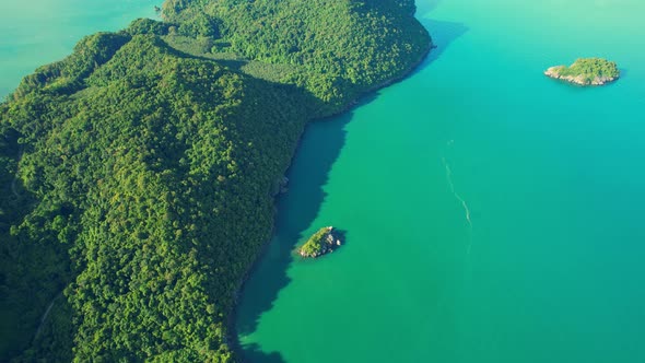 An aerial view of the unique turquoise waters and beautiful mountain coast