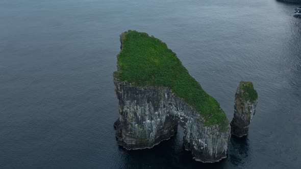 Drone Arcing Over Drangarnir Sea Stacks In Faroe Islands