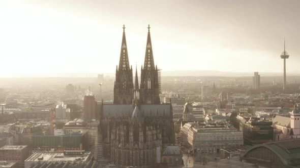 AERIAL: Towards Cologne Cathedral and TV Tower in Beautiful Hazy Sunlight with Rain 