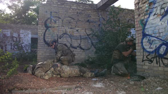 Ranger Providing Medical Care To Wounded Soldier