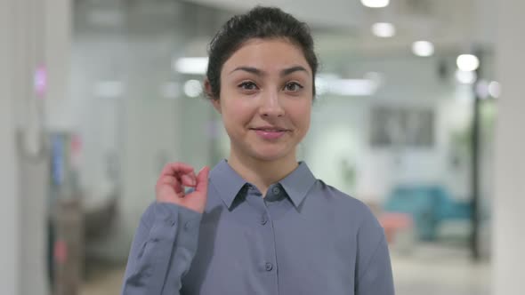 Portrait of Indian Woman Pointing at Camera