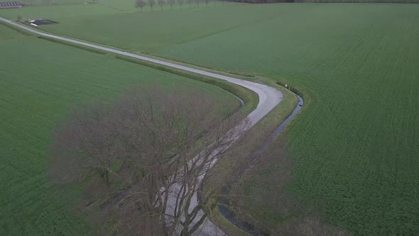 Aerial Cinematic Clip Drone Flying Over a Farm Field During Sunset