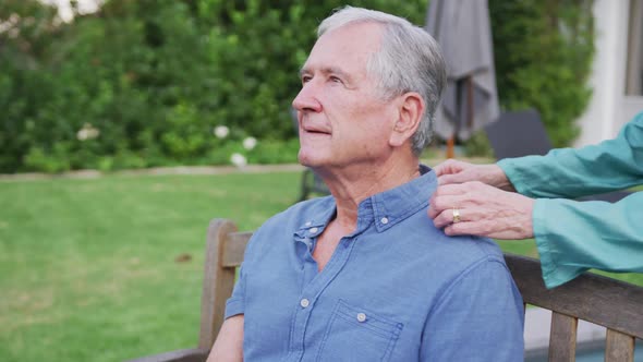 Senior Caucasian couple smiling and spending time together in the garden