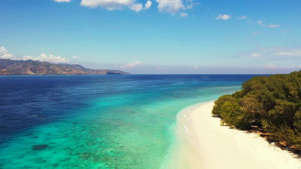 Wide angle drone abstract shot of a white sandy paradise beach and turquoise sea background in vibra