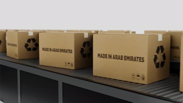 Boxes with MADE IN Arab Emirtates Text on Conveyor