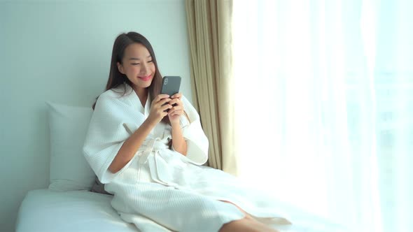 Young asian woman use smart phone