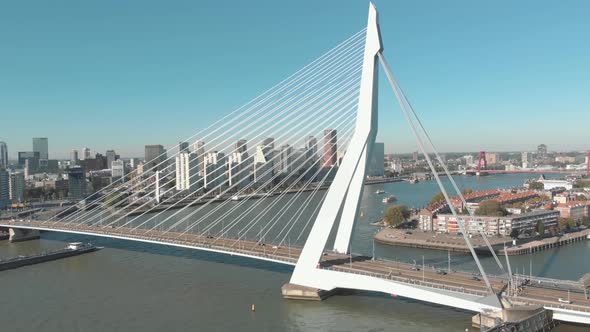 Drone footage of the Erasmus Bridge, The Swan, crossing over the few water channels of Rotterdam