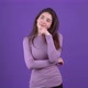 The Beautiful Serious Girl is Sitting with Her Hand on Her Chin and Thinking About the Solution - VideoHive Item for Sale