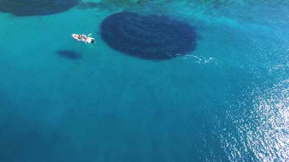 Aerial view of a boat passing sandy beach on the island of Brac, Croatia