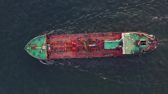 The Tanker Sails on the Sea at Sunset