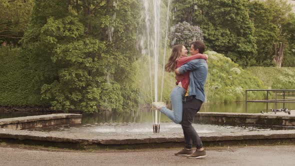 Young, happy, loving couple having date in the park. Relations, friendship and love concept.