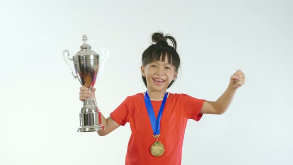 Little Girl Rejoicing With Trophy