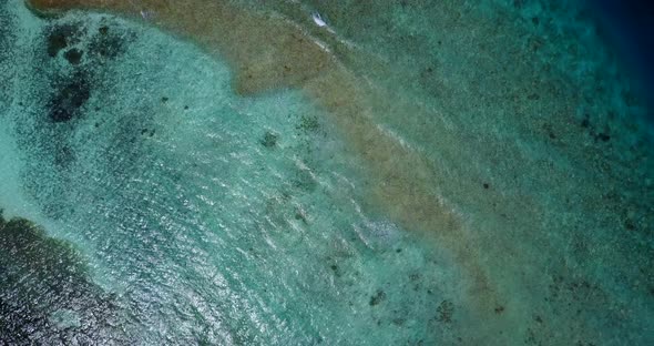 Wide fly over abstract view of a paradise sunny white sand beach and aqua blue ocean background in 4