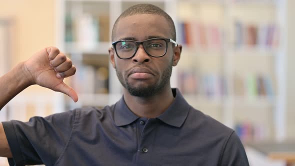 Portrait of Young African Man Showing Thumbs Down