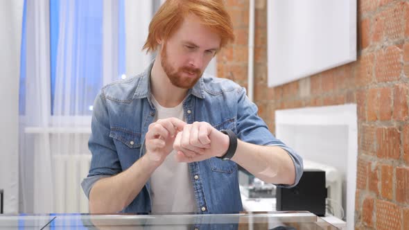 Man Using Smartwatch for Browsing