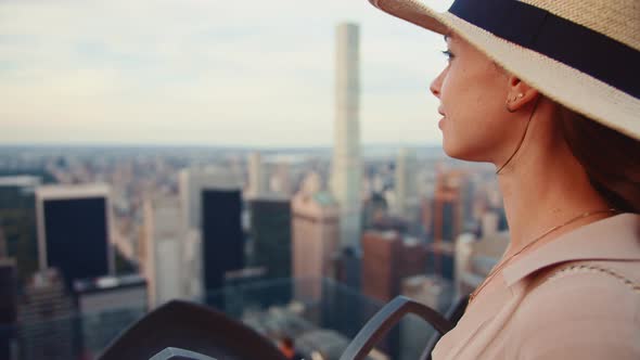 Beautiful girl with a retro camera in New York