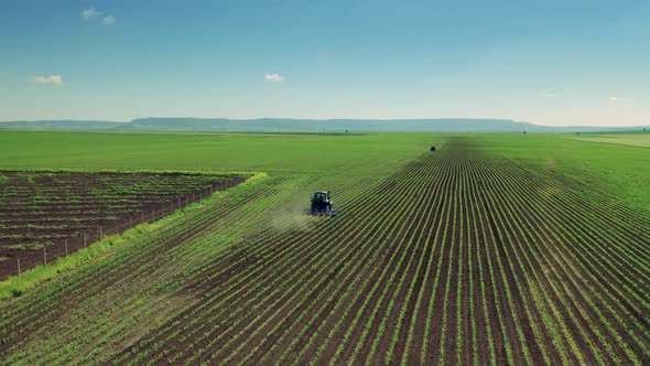 Tractor Cultivating Field At Spring, Aerial View. 