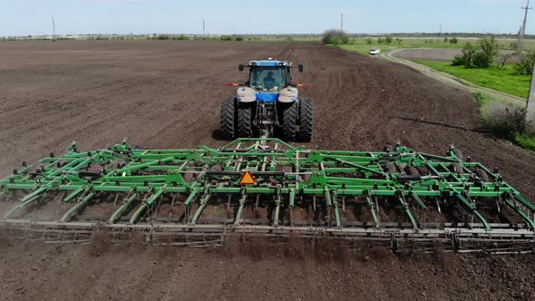 Wheeled Tractor with Harrows