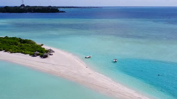 Aerial scenery of tropical shore beach trip by blue lagoon with sand background