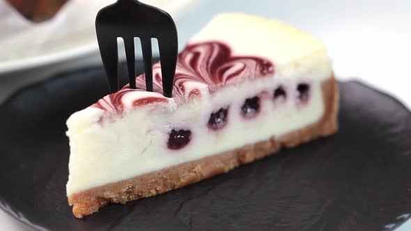 Piece of cheesecake with jam